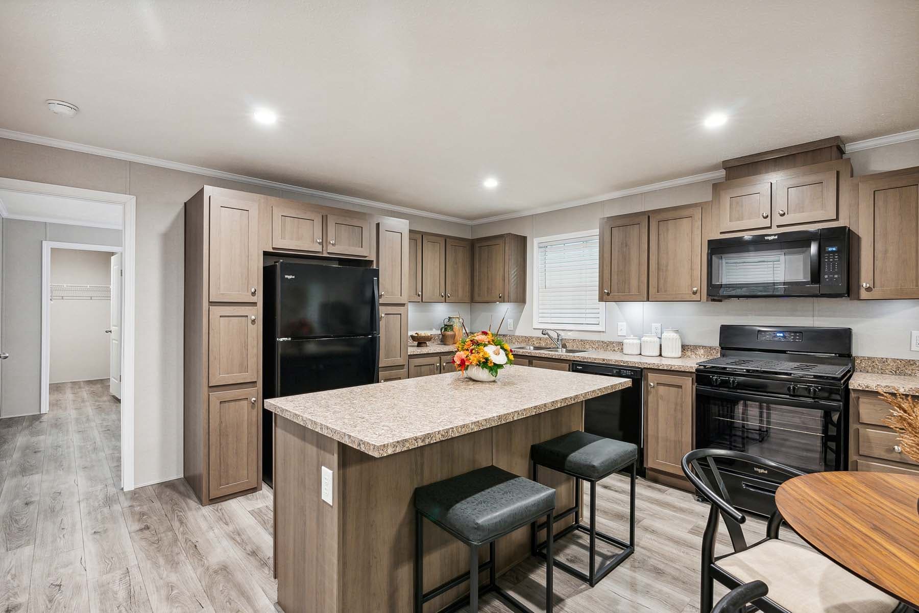 Click to enlarge 1672H32087 single wide home — kitchen (photo 9 of 16)