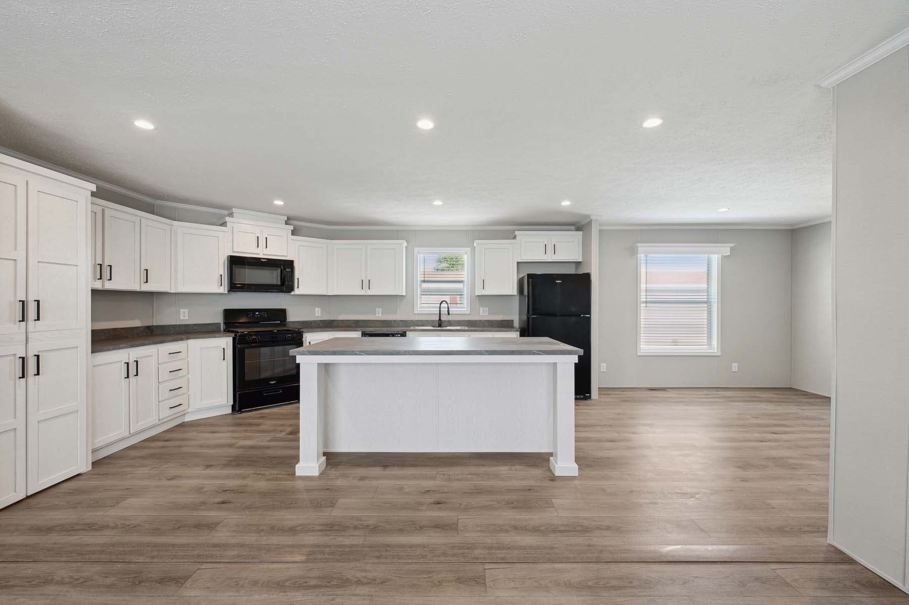 Click to enlarge Woodward multi-section home β kitchen (photo 8 of 18)