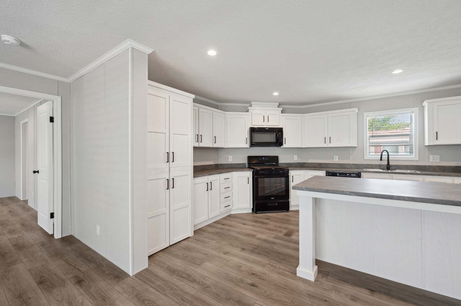 Click to enlarge Woodward multi-section home β kitchen (photo 9 of 18)
