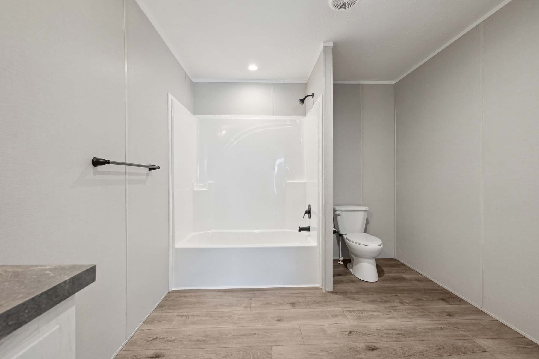 Click to enlarge Woodward multi-section home β primary bathroom (photo 12 of 18)