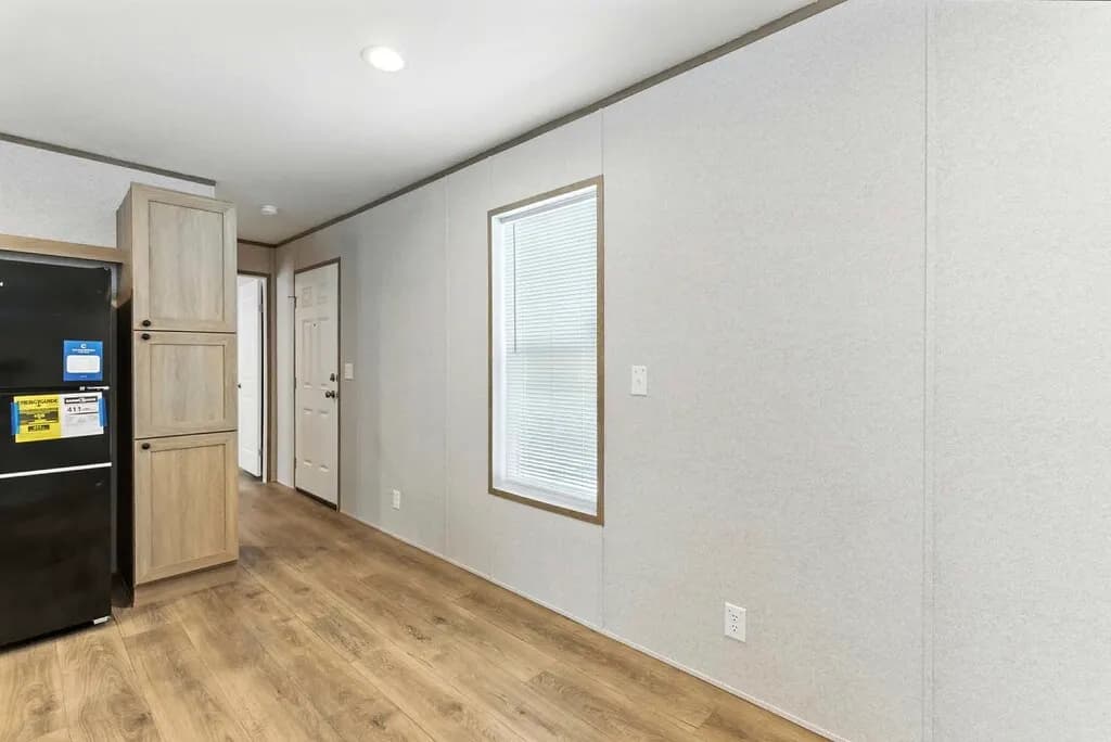 Click to enlarge Monte single wide home — dining area (photo 5 of 37)