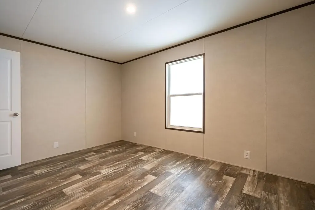 Click to enlarge Ridge Reverse Aisle single wide home — primary bedroom (photo 6 of 7)
