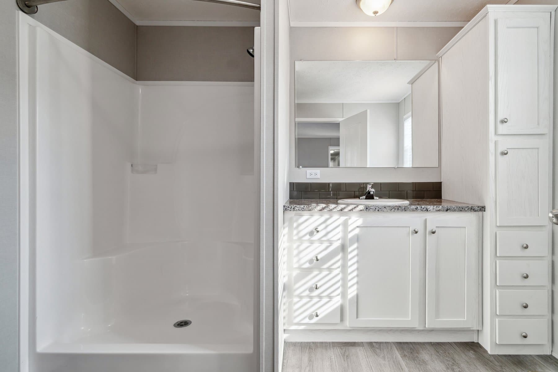 Click to enlarge 1672H32184 single wide home — primary bathroom (photo 35 of 40)
