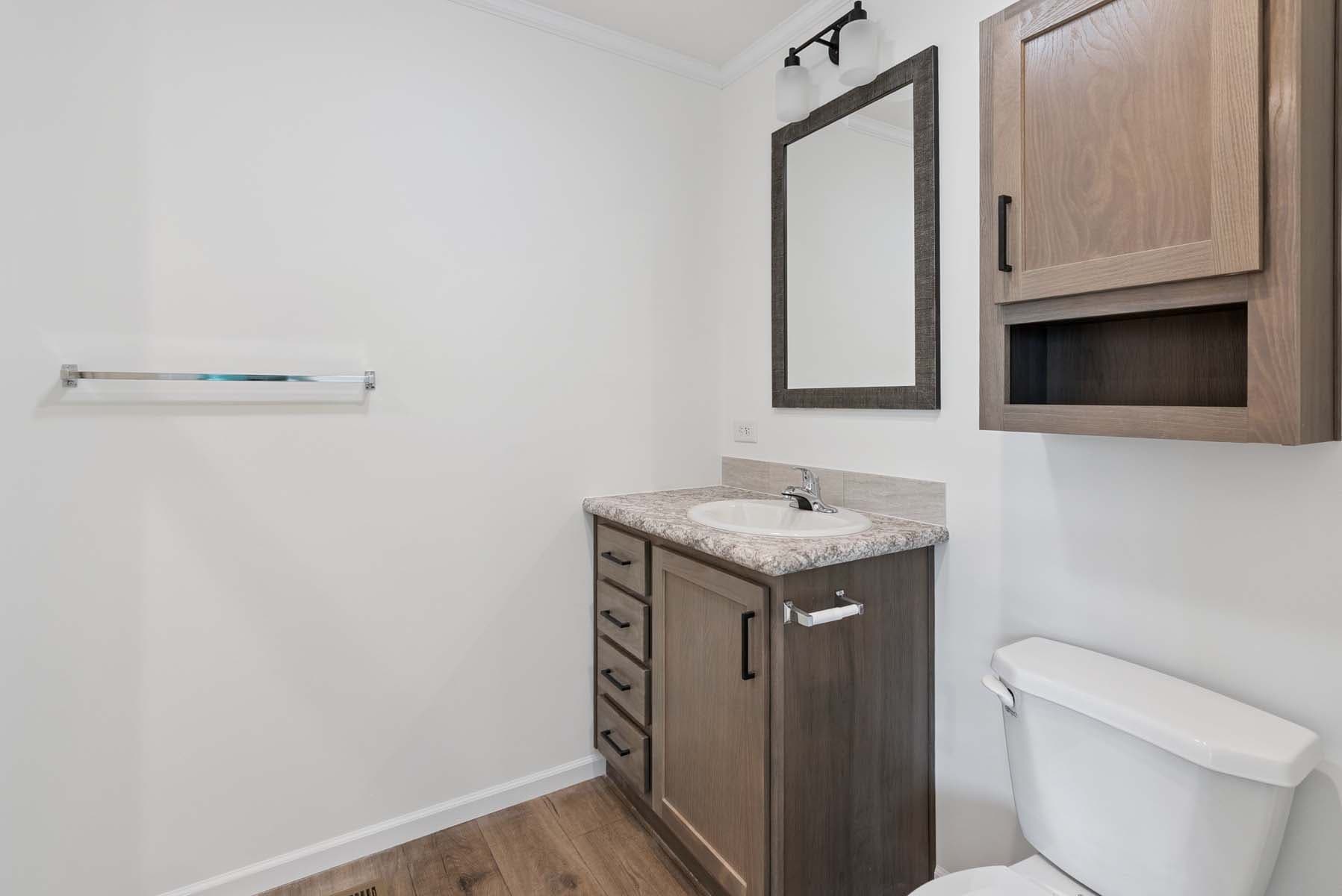 Click to enlarge 1676H32221 single wide home — primary bathroom (photo 11 of 15)
