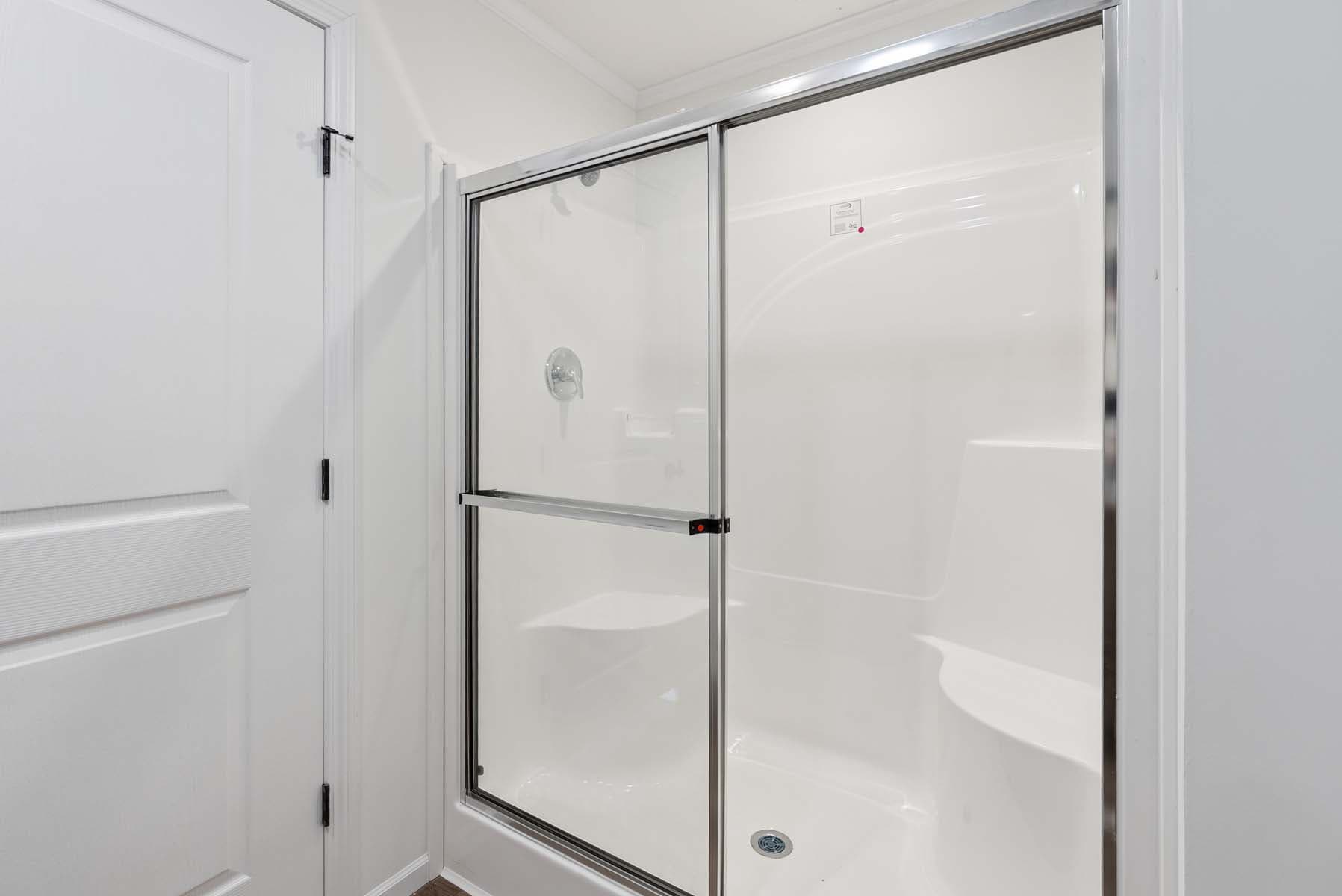 Click to enlarge 1676H32221 single wide home — primary bathroom (photo 12 of 15)