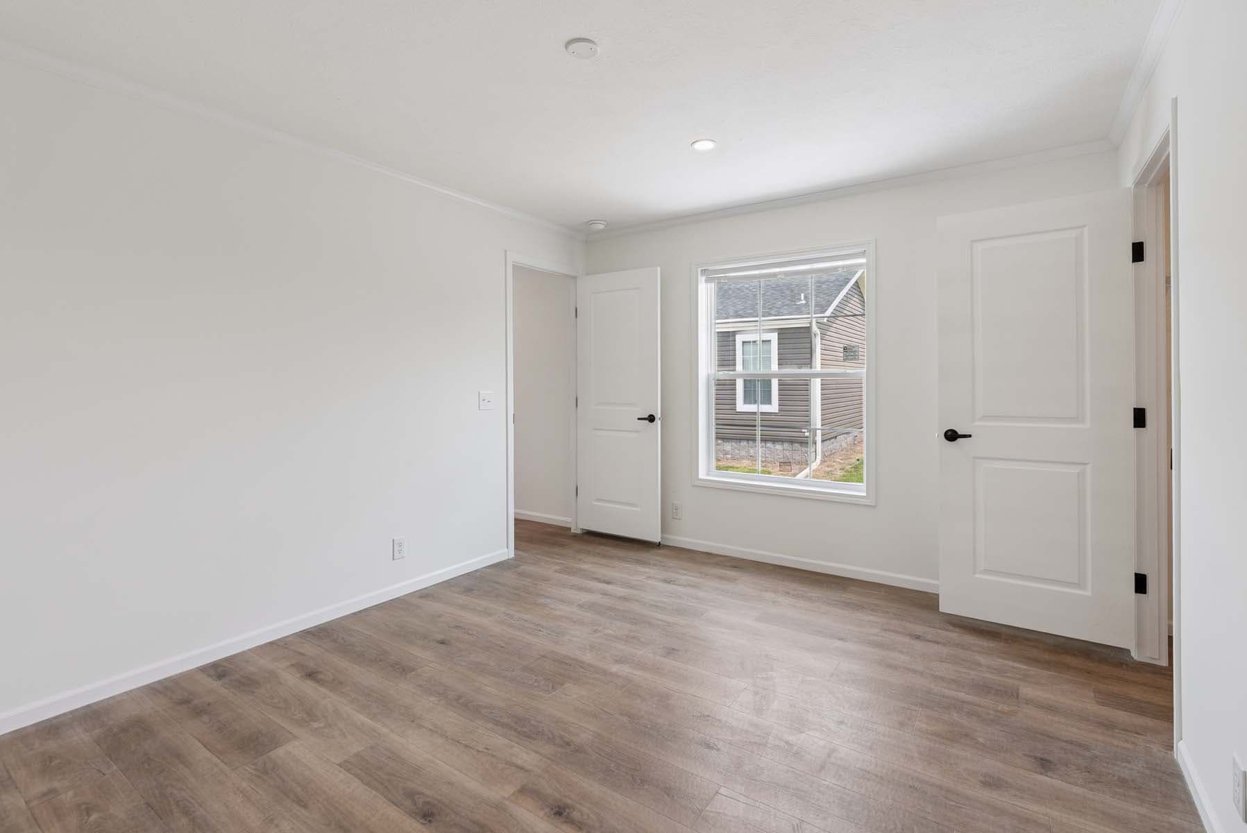 Click to enlarge 1676H32221 single wide home — primary bedroom (photo 15 of 15)